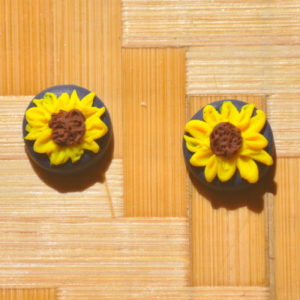 yellow sunflower stud earrings on navy